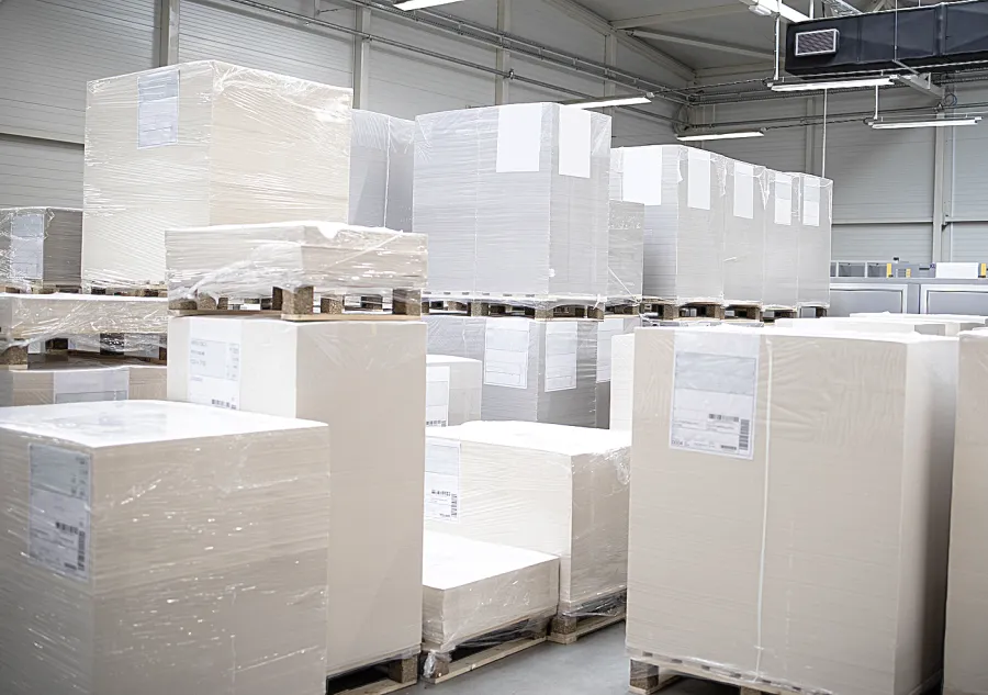 Pallets of paper in the storeroom of a printing company