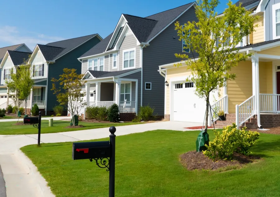 A residential street with mailboxes in foreground