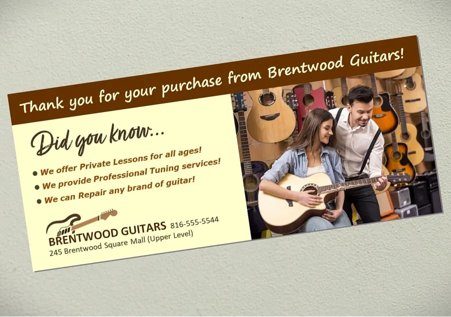 A promotional Buckslip for a retail guitar store