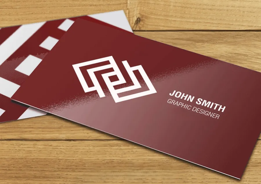 A printed business card with a glossy finish