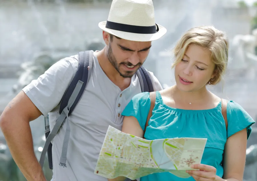 a man and a woman looking at a map