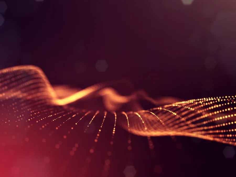 Abstract digital wave of glowing orange dots on dark purple background with smooth flowing curves.