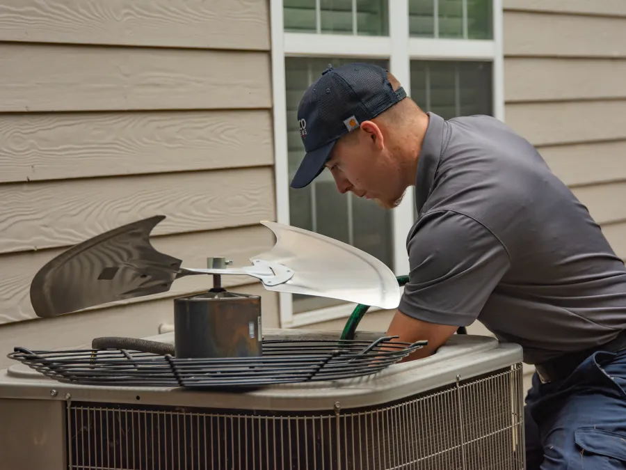 a man cooking food on a grill