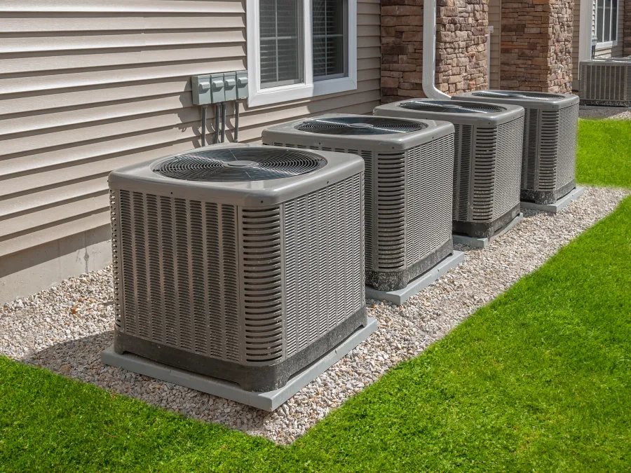 a group of metal containers on grass