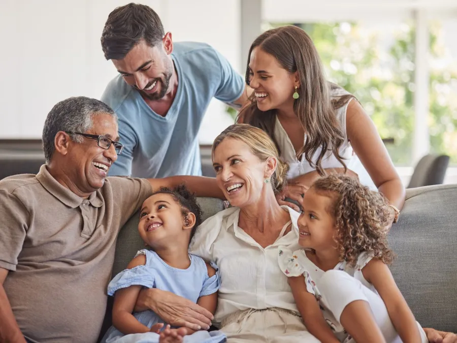 a family sitting on a couch