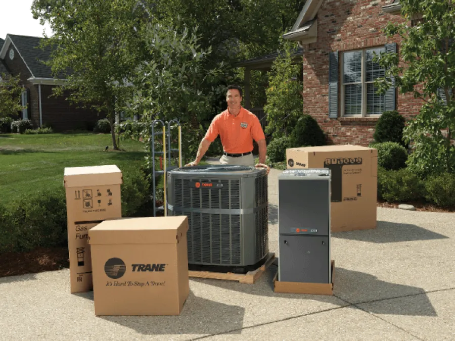 a man standing next to a stack of boxes