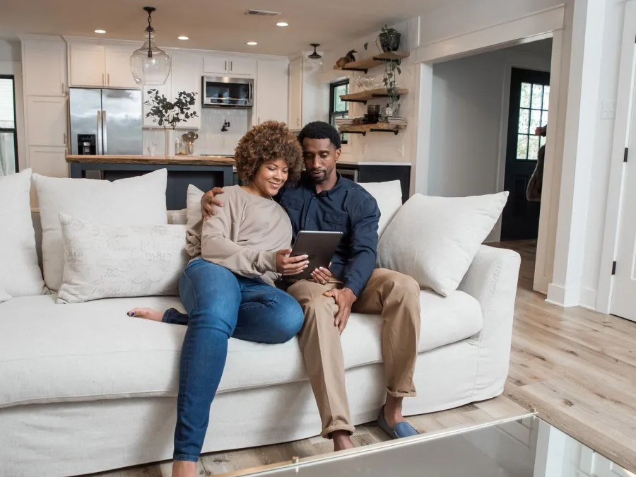 a man and woman sitting on a couch