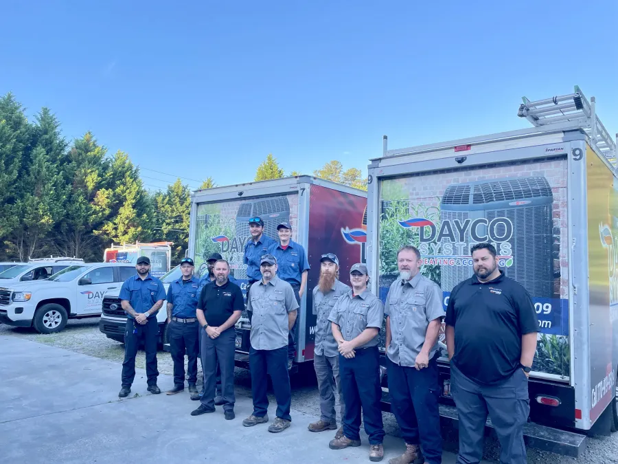 a group of people standing in front of a food truck