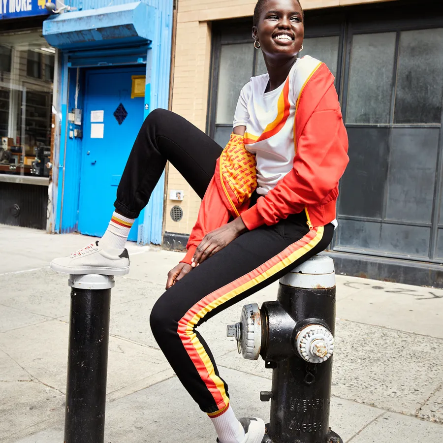 a person sitting on a fire hydrant