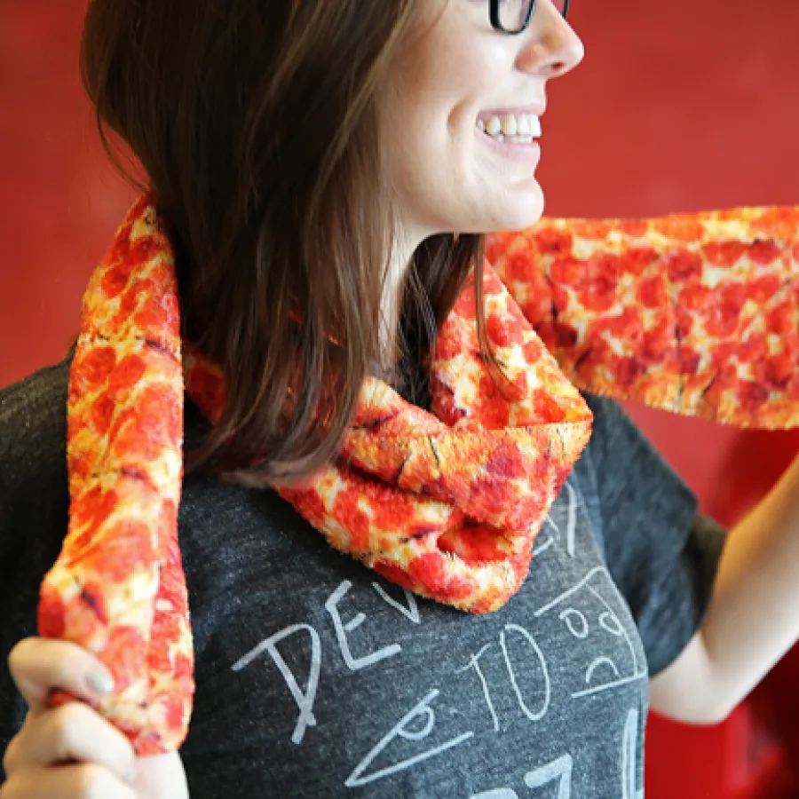 a woman holding a pizza