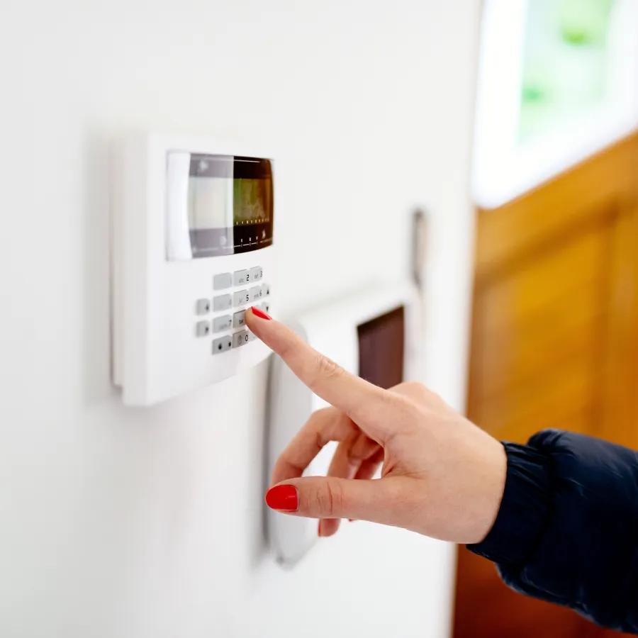 a hand pointing at a keypad