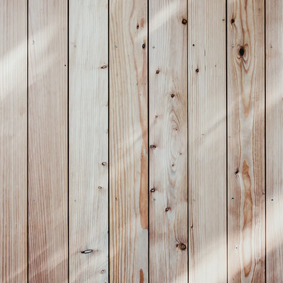 a wood surface with holes
