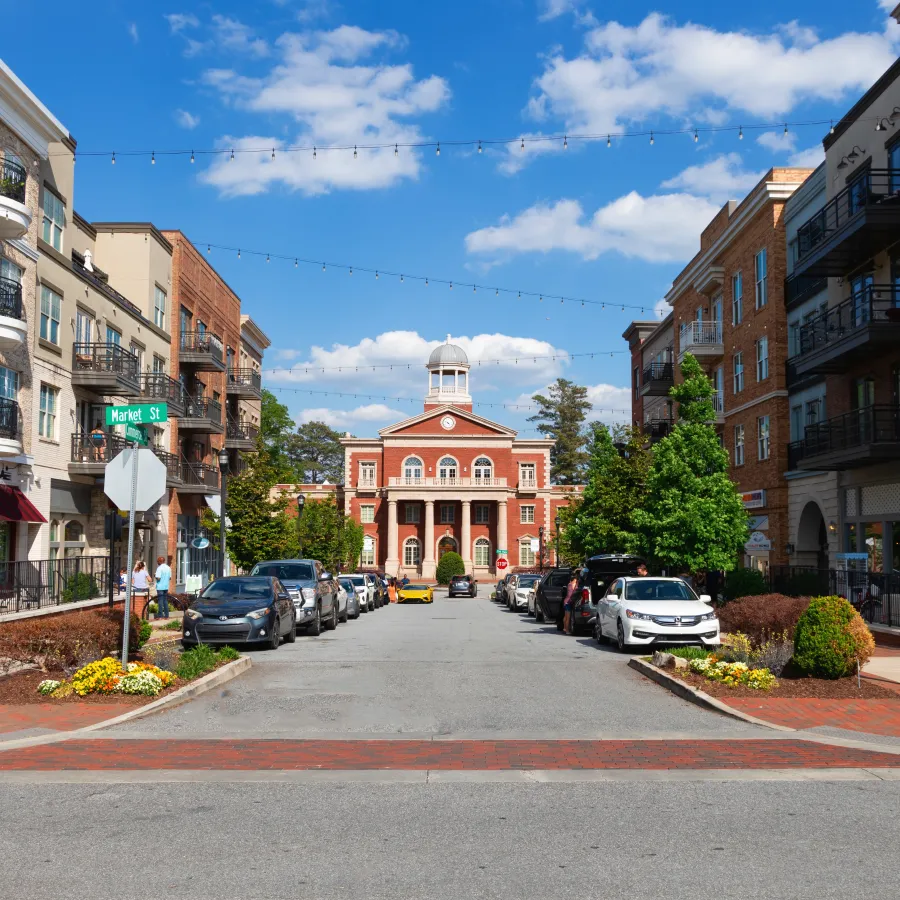 a street with cars and buildings on the side