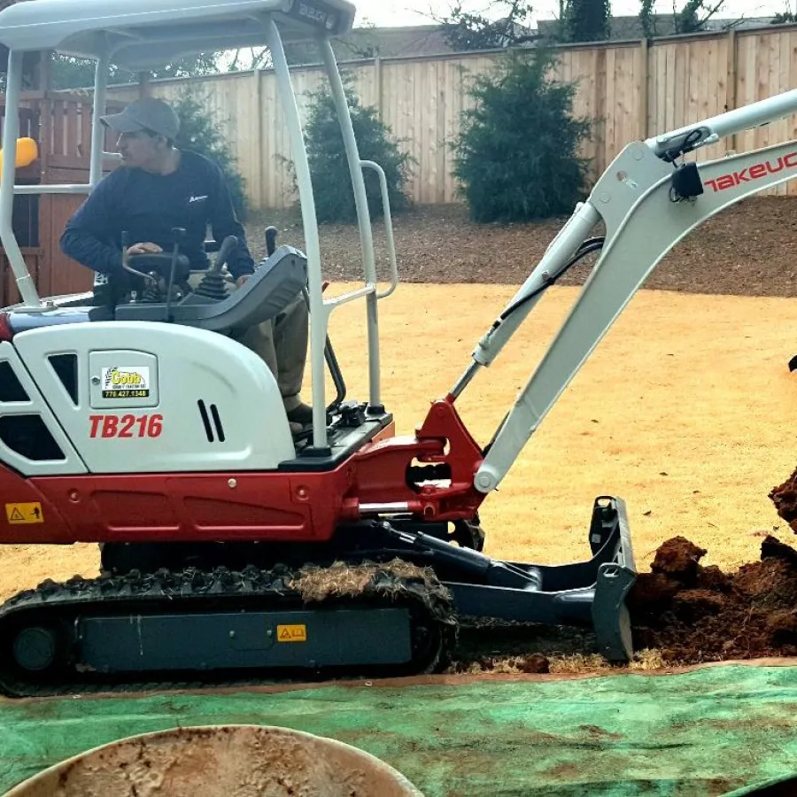 a person driving lawn equipment