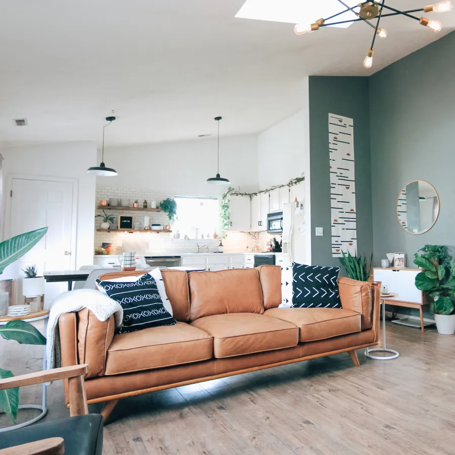 a living room with a couch and chairs