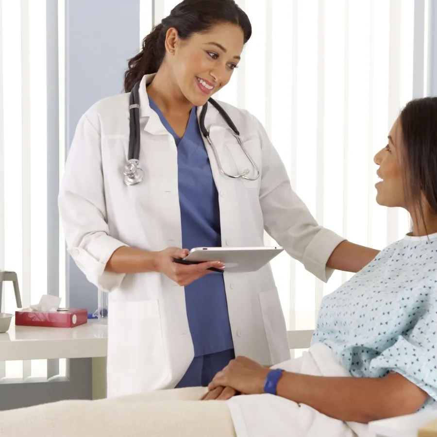 a doctor showing a patient something on the tablet