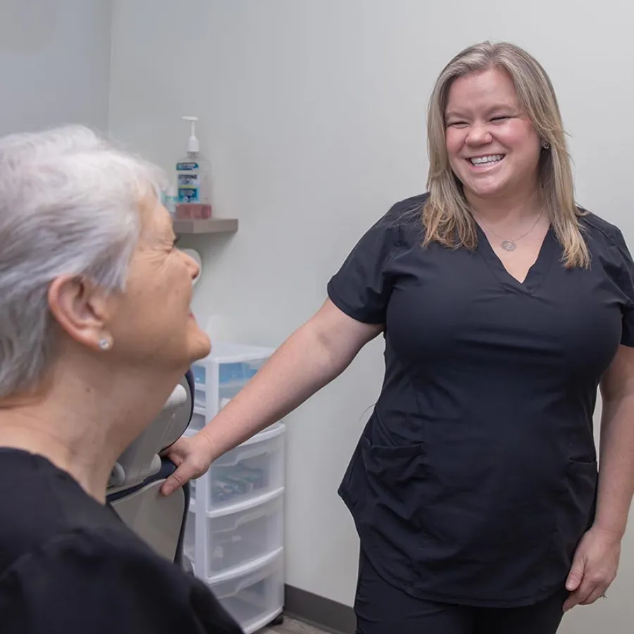 a man and a woman smiling