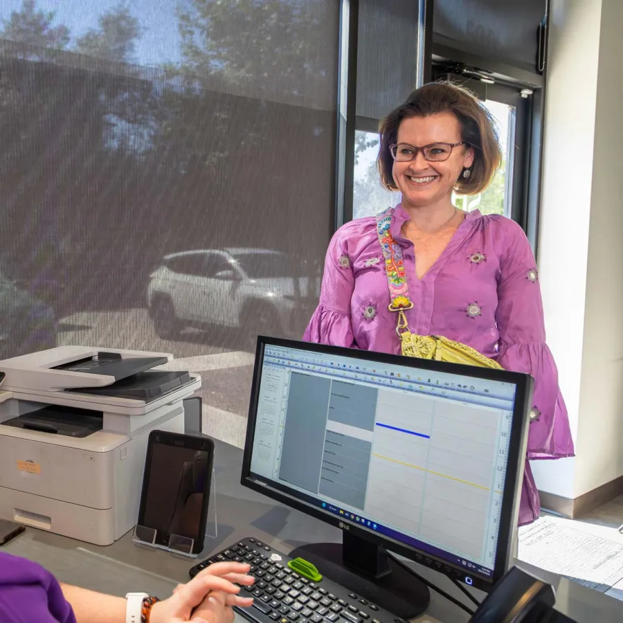 a person brushing a baby's teeth