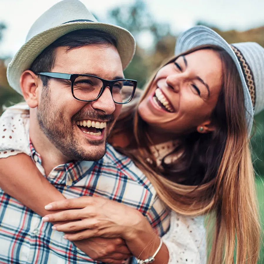 a man and woman smiling