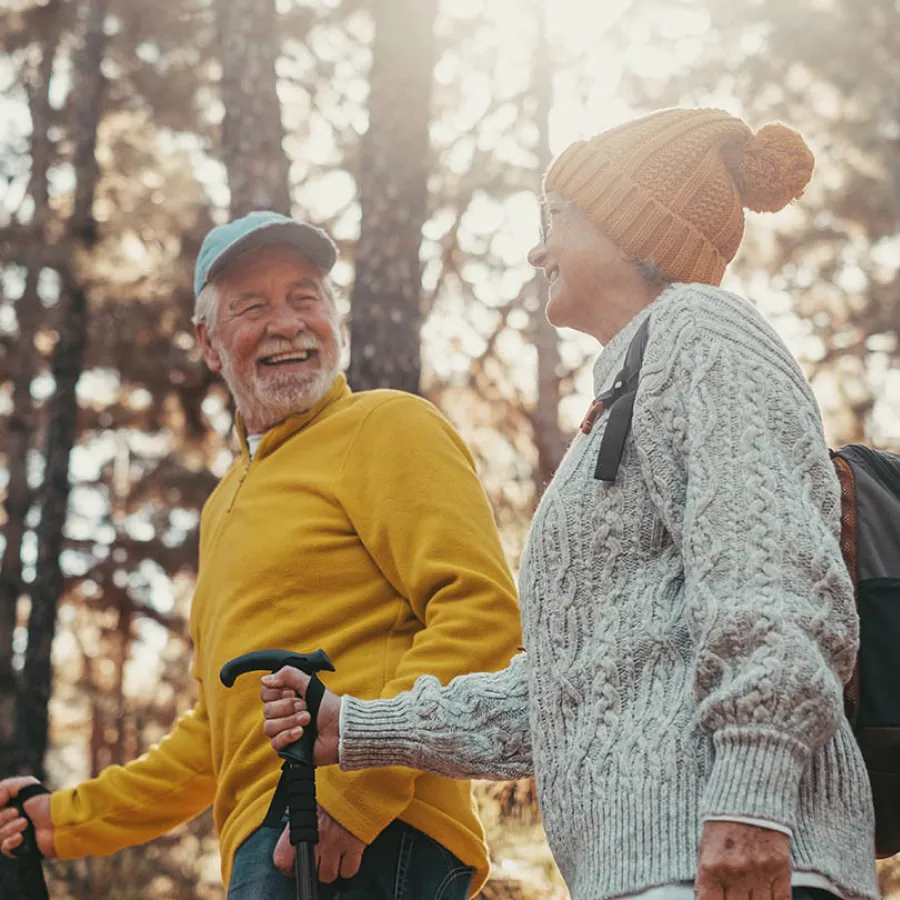 a woman smiling with her hand on her chin