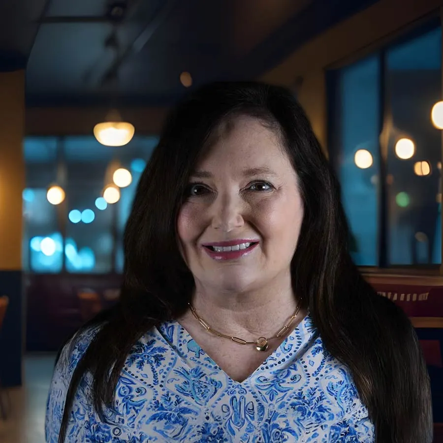 a woman smiling for the camera