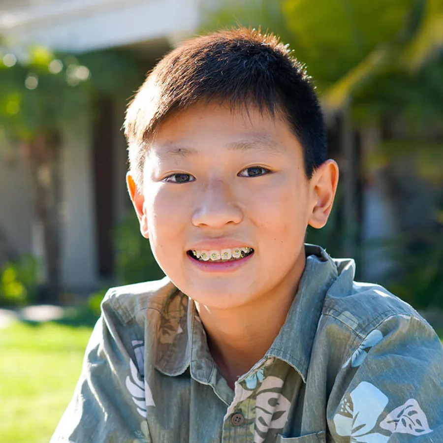 a boy smiling for the camera