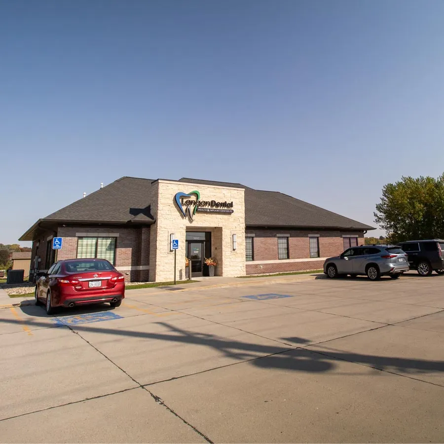 a building with cars parked in front