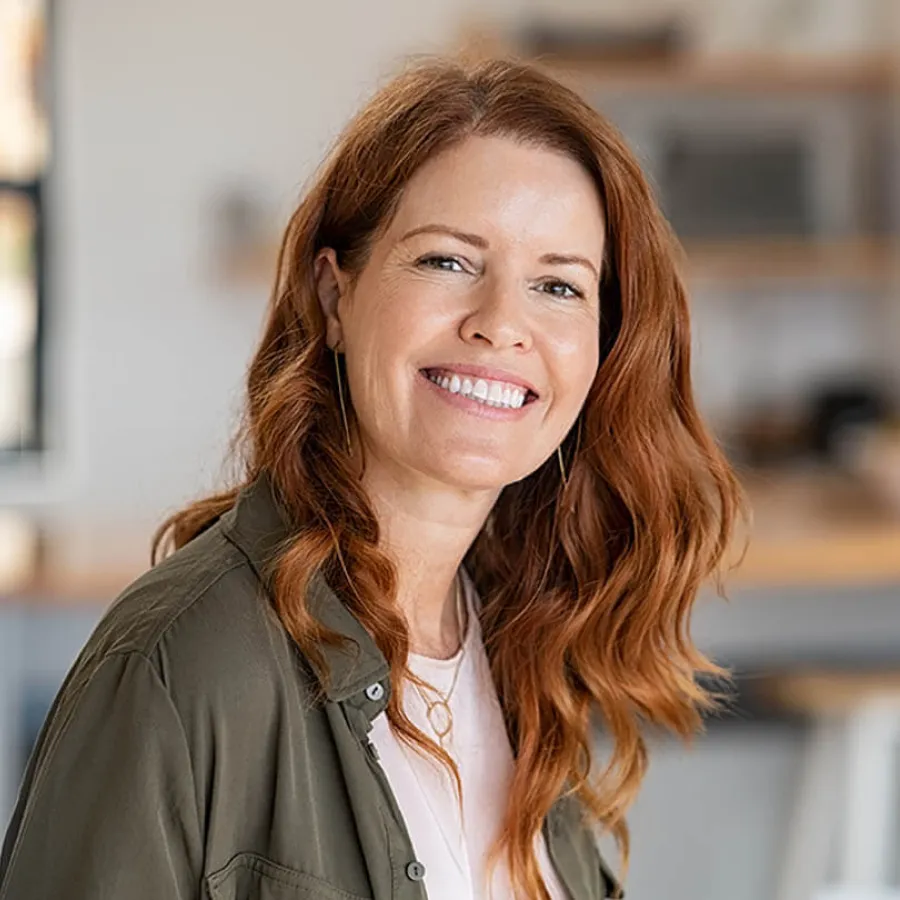 a woman with long hair smiling