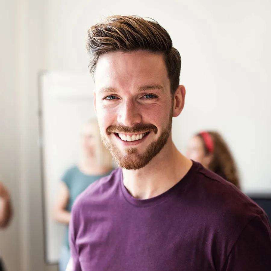 a man smiling for the camera