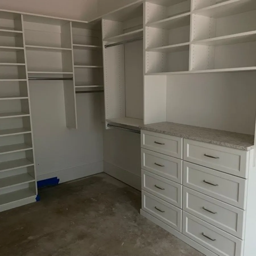 a room with white cabinets