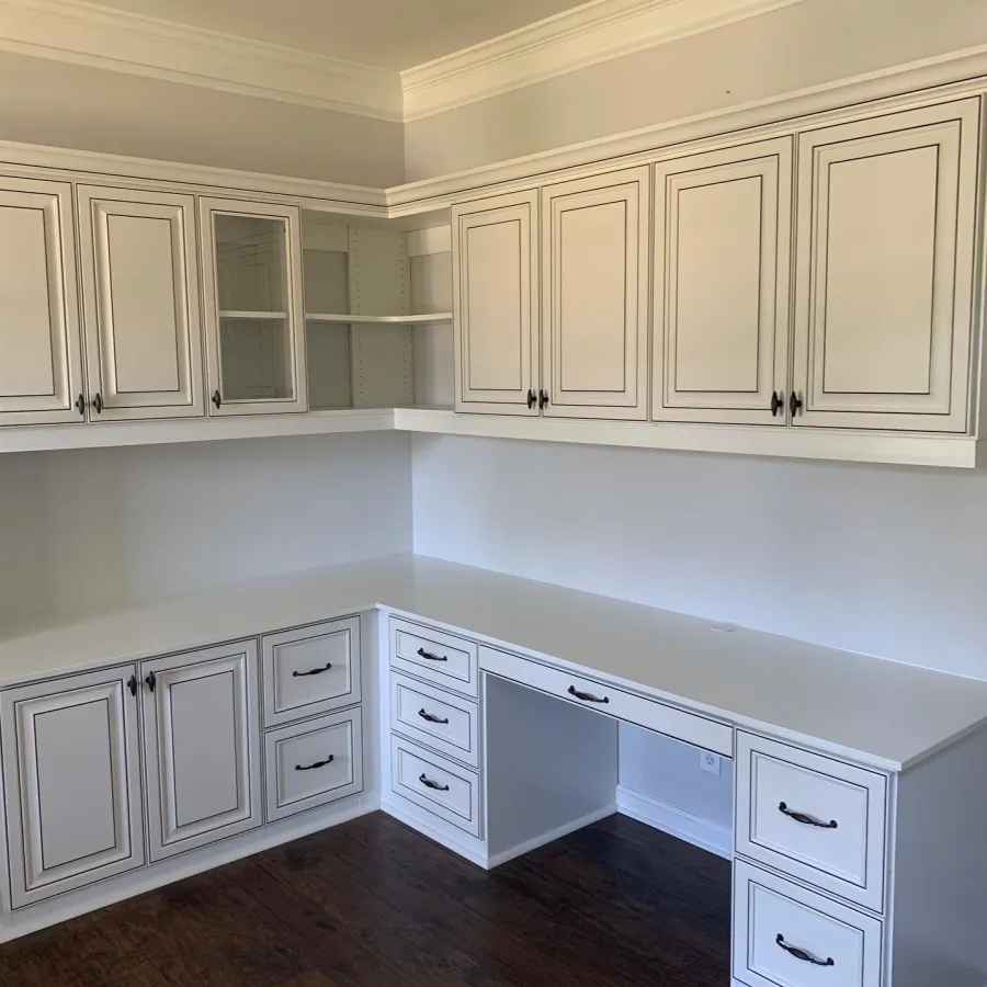 a kitchen with white cabinets