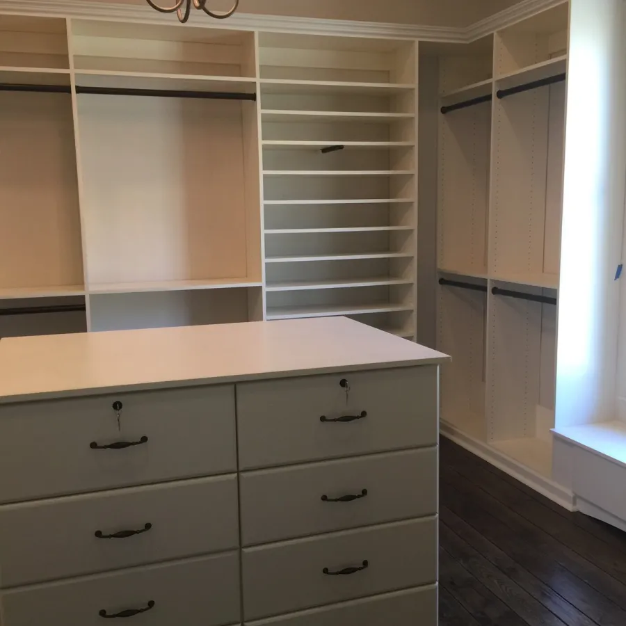 a white cabinet with drawers