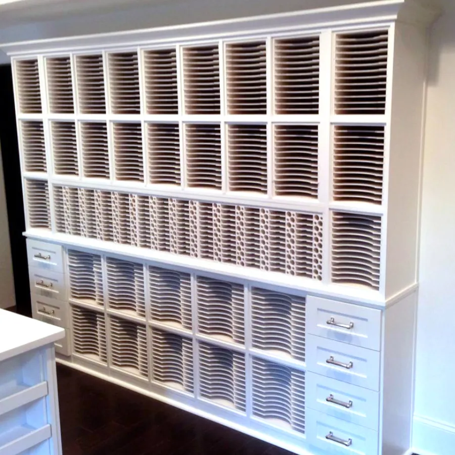 a white cabinet with a white shelf