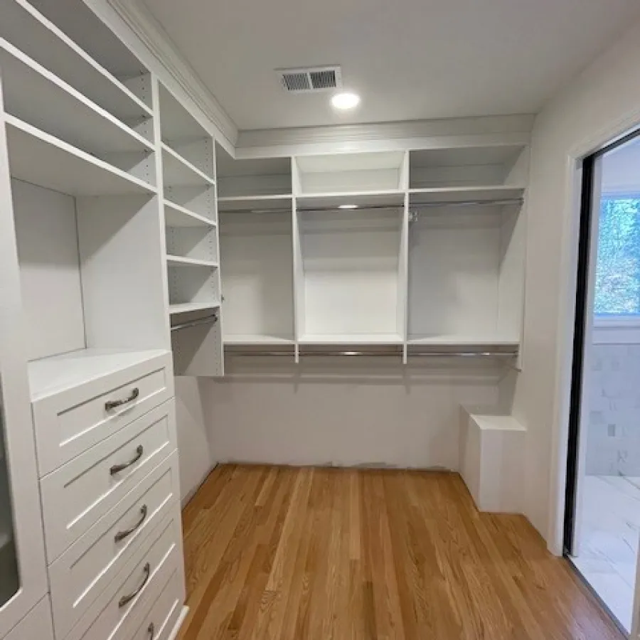 a room with white shelves