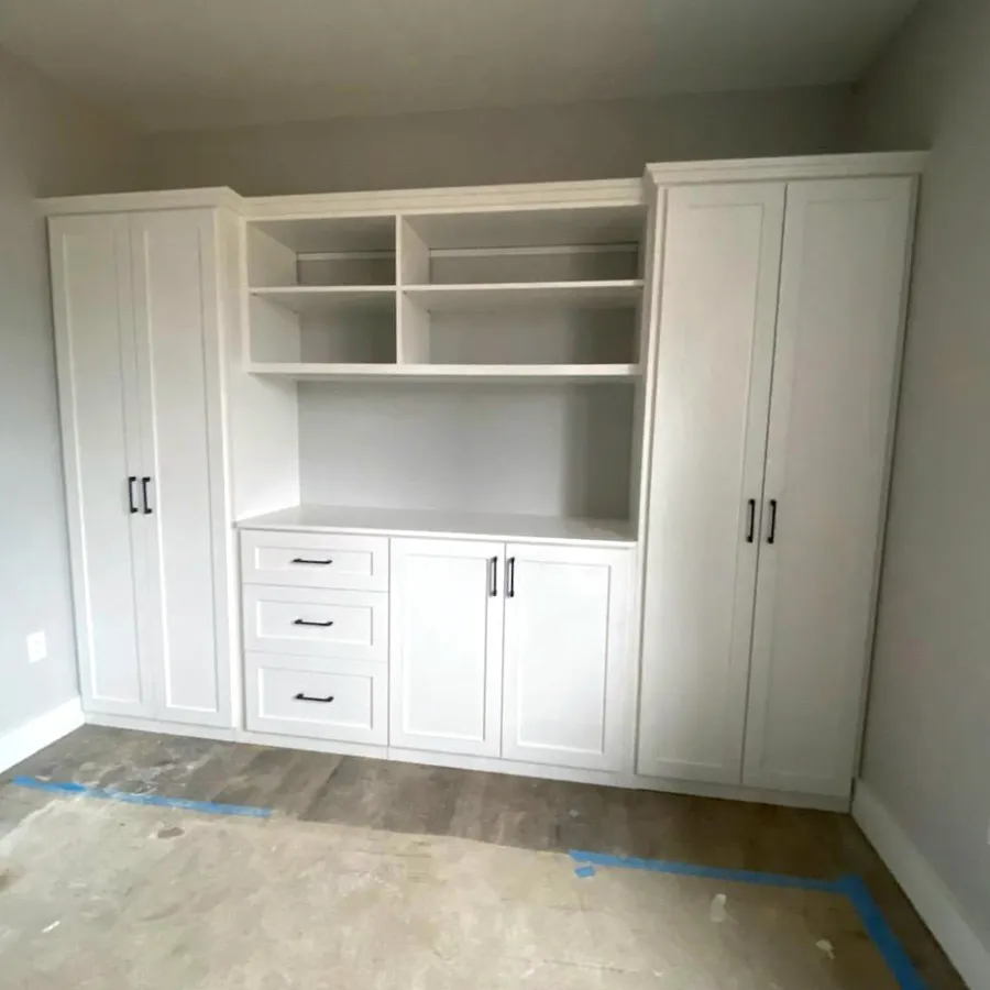 a white cabinet with white drawers