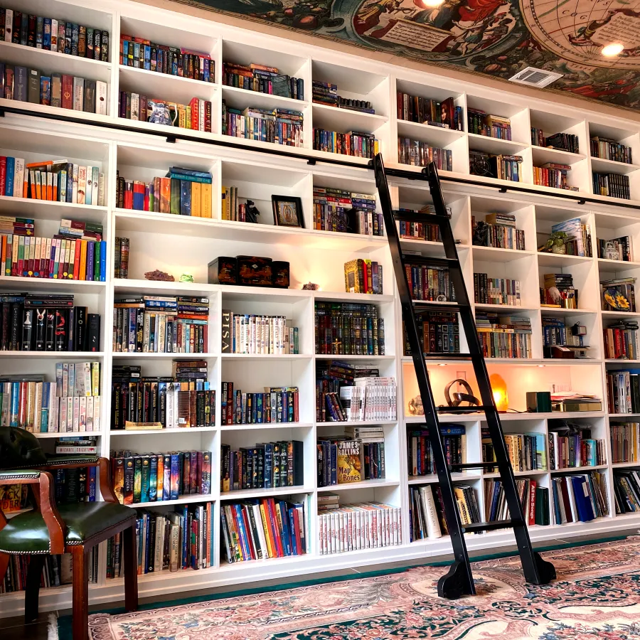 a large book shelf with many books