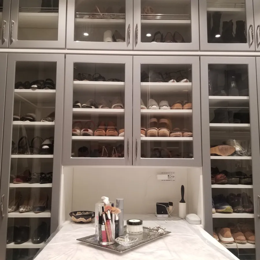 a room with many shelves and objects