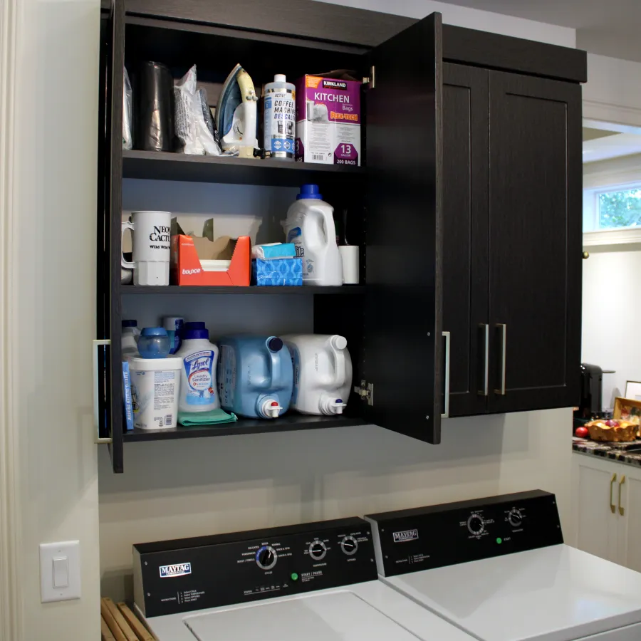 a kitchen with a shelf and cabinets