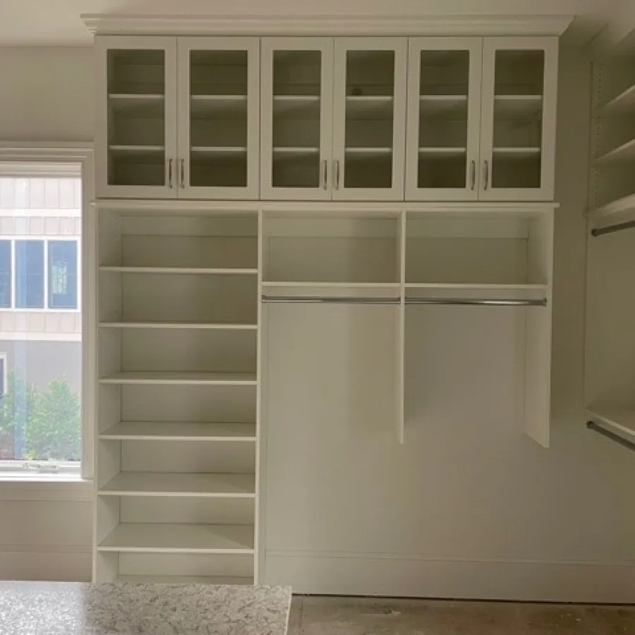 a white cabinet with white drawers