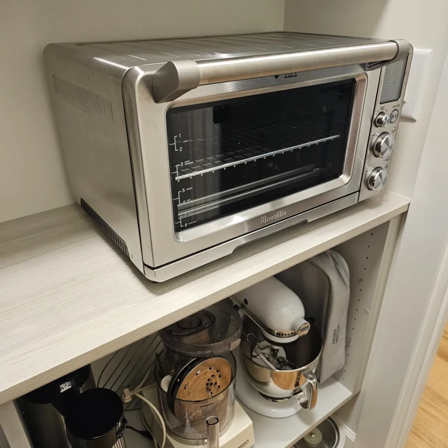 a toaster oven with a couple of bottles in it