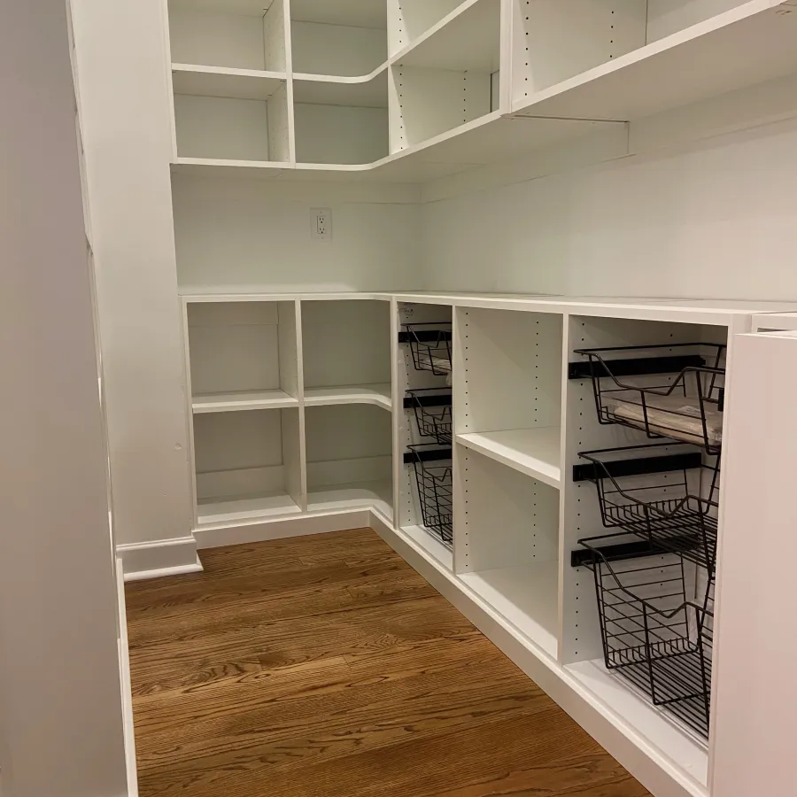 a white shelving unit with shelves