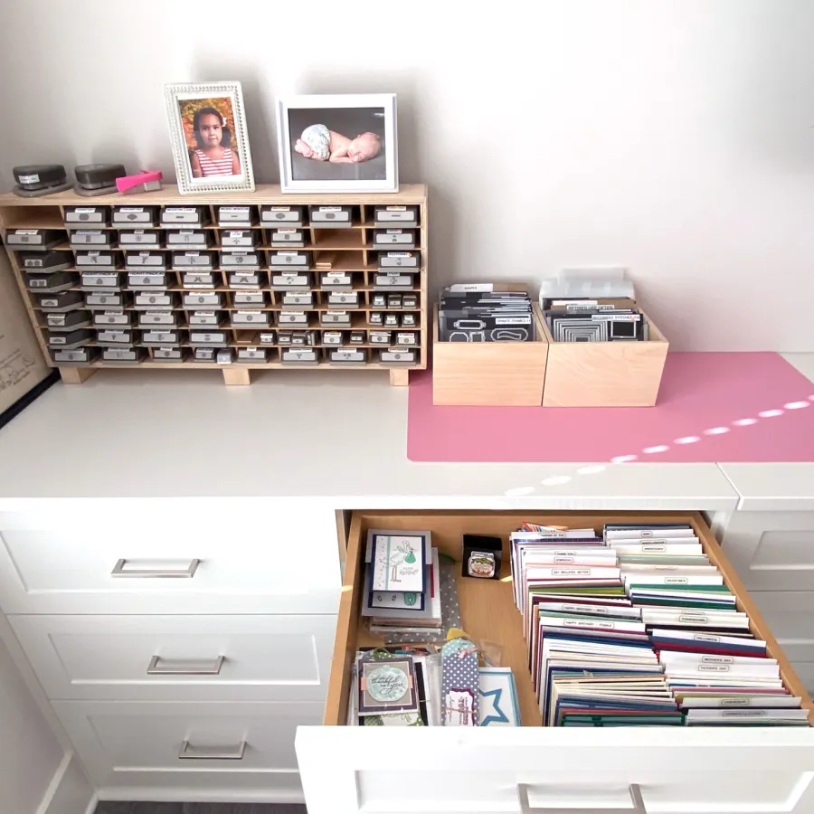 a shelf with books and pictures on it