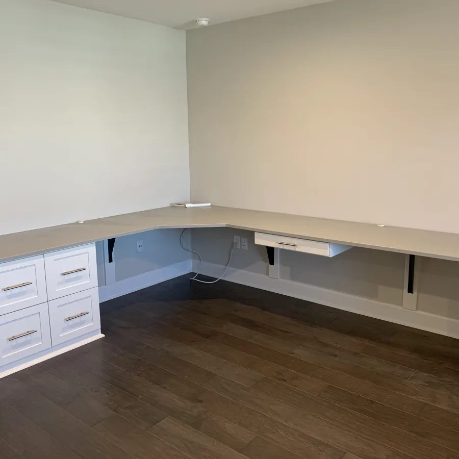 a white shelf with drawers