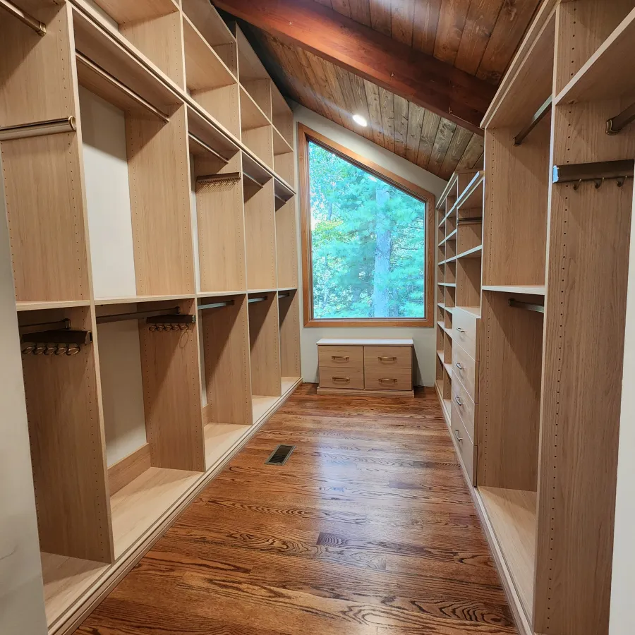 a room with a wood floor and a window