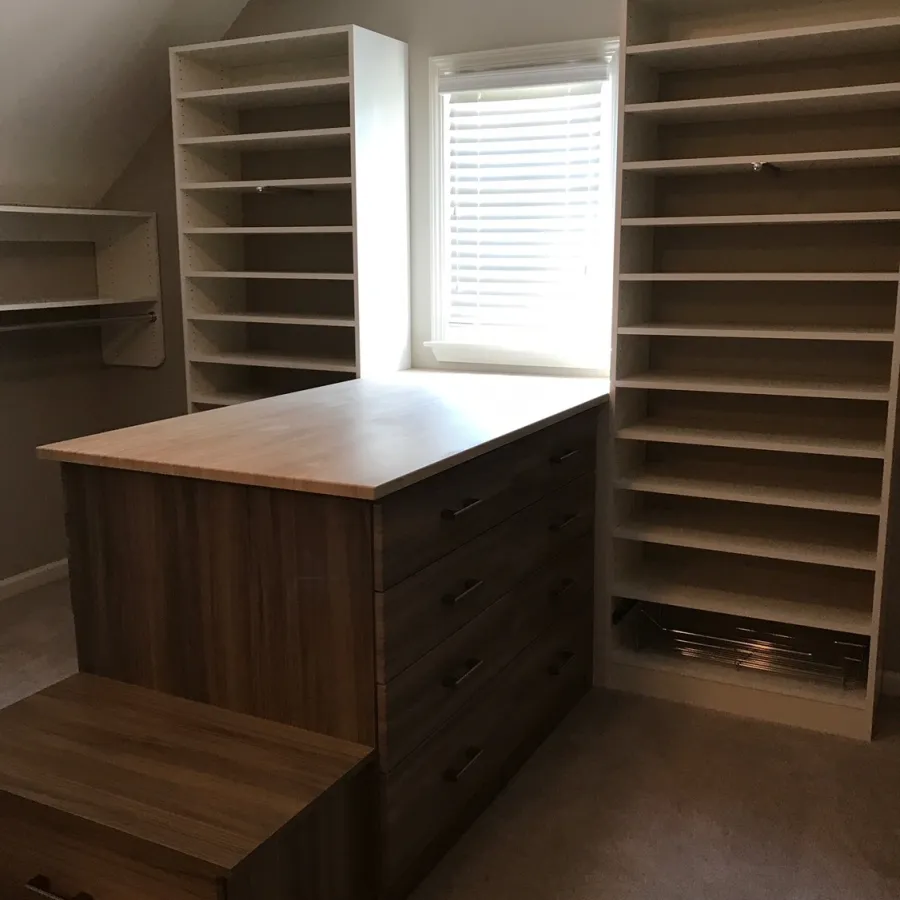 a room with a wood cabinet and a window