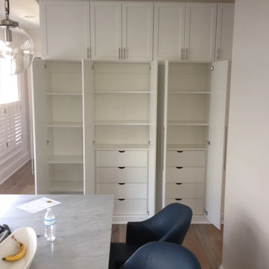 a white cabinet in a room