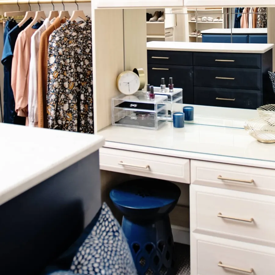 a room with a blue bucket and a white counter with a blue bucket