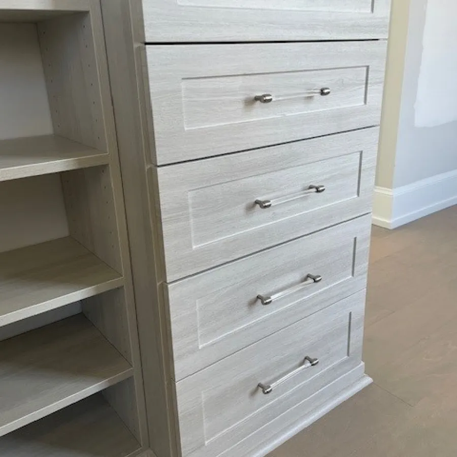 a white dresser with drawers