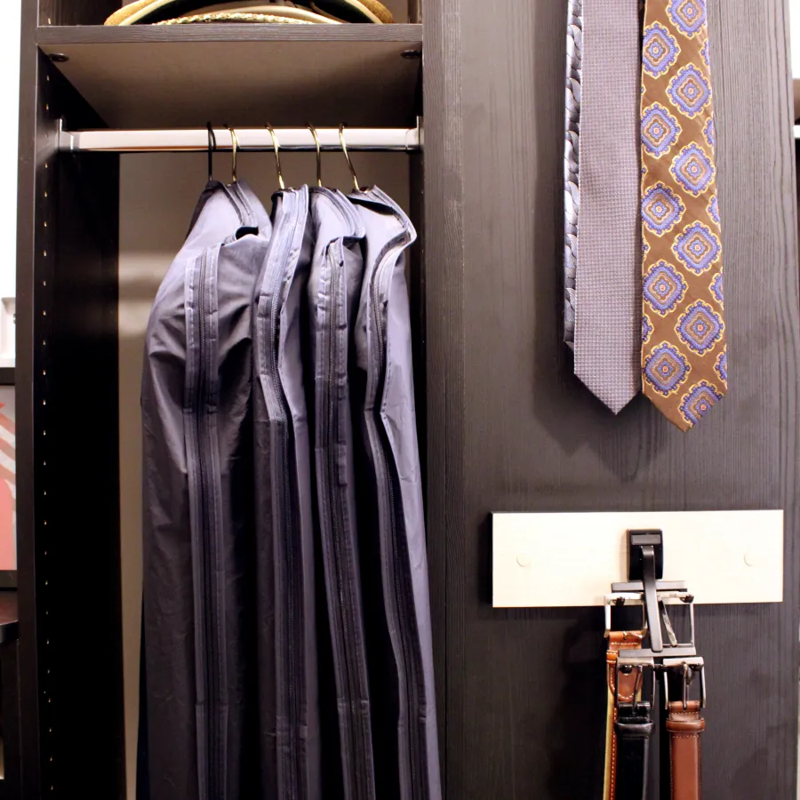 a closet with a hat and clothes