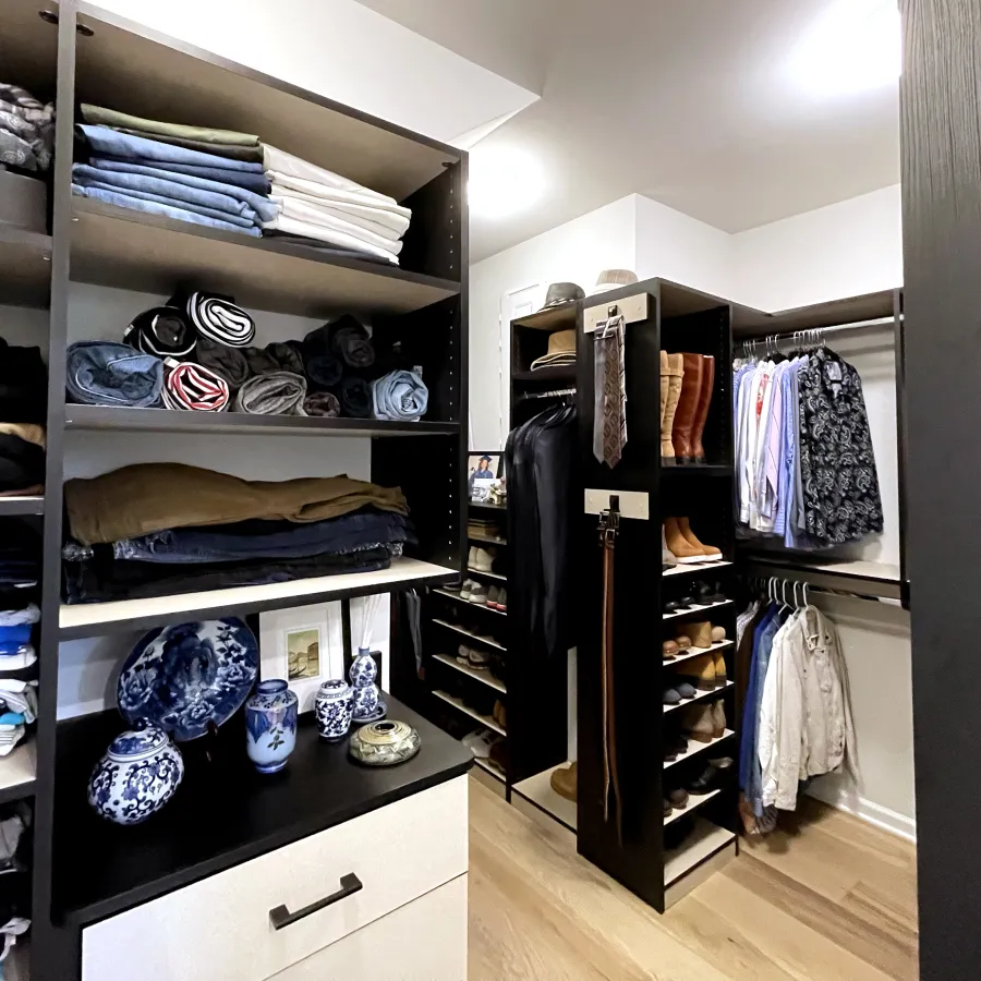 a closet with clothes and shoes